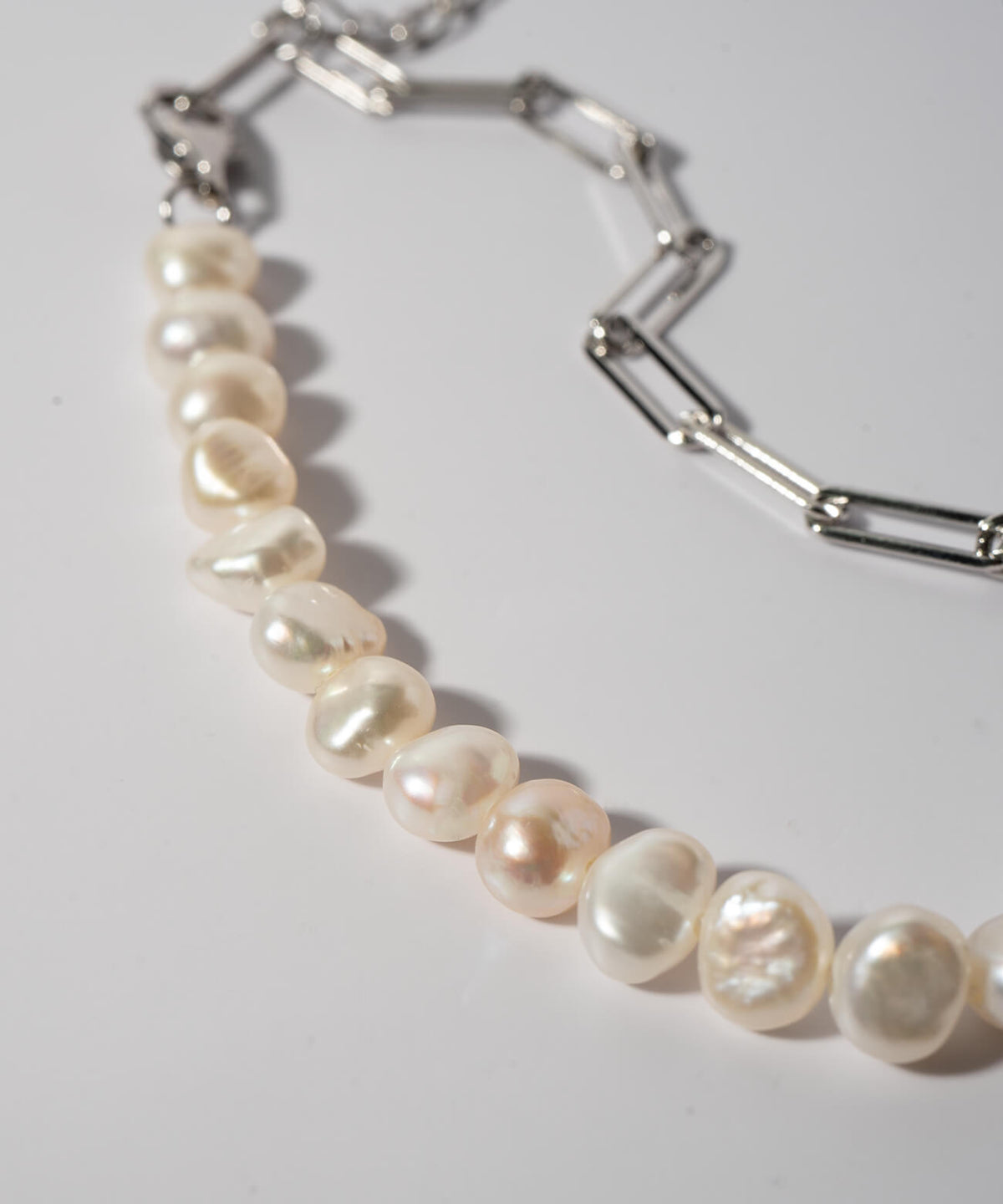 Baroque pearl and paperclip chain detail