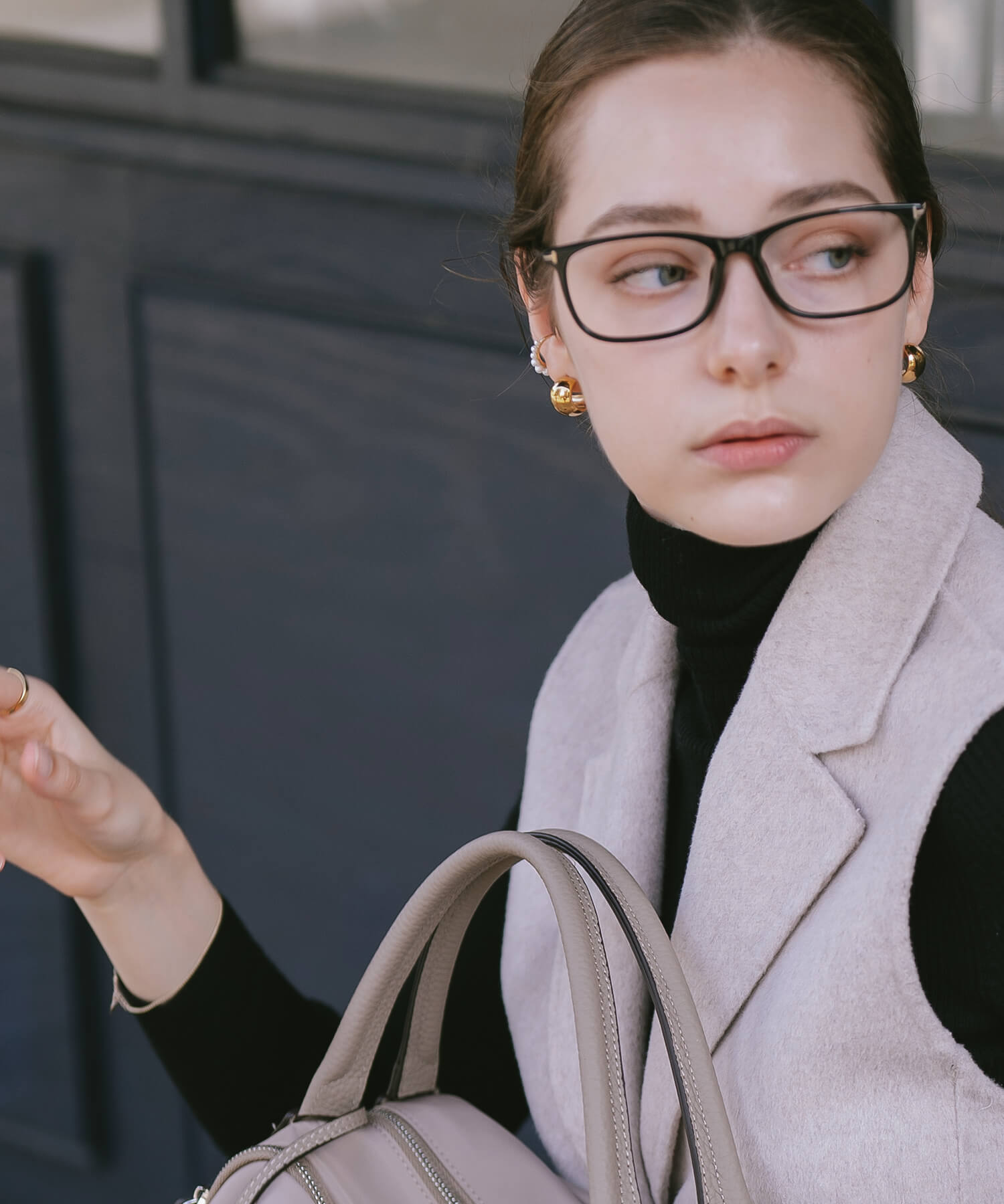 Gold statement hoop earrings styled with a jacket