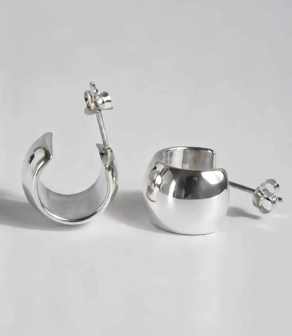 Wide and substantial barrel hoop earring detail
