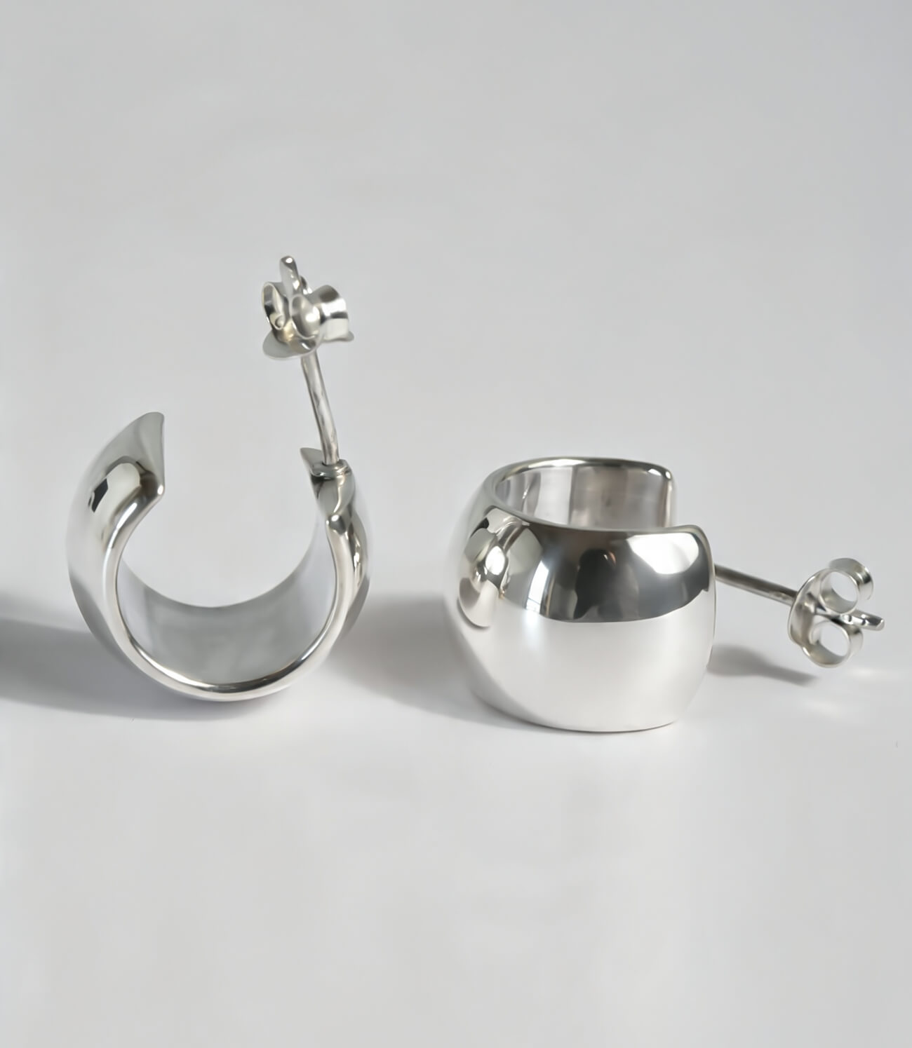 Wide and substantial barrel hoop earring detail