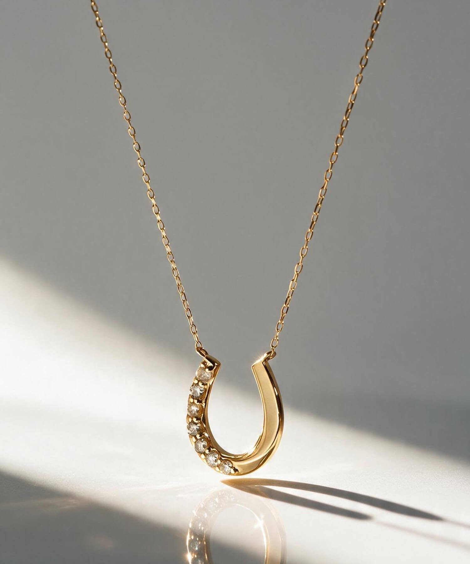 18K Gold & Platinum Diamond Horseshoe Necklace | COUPELLE