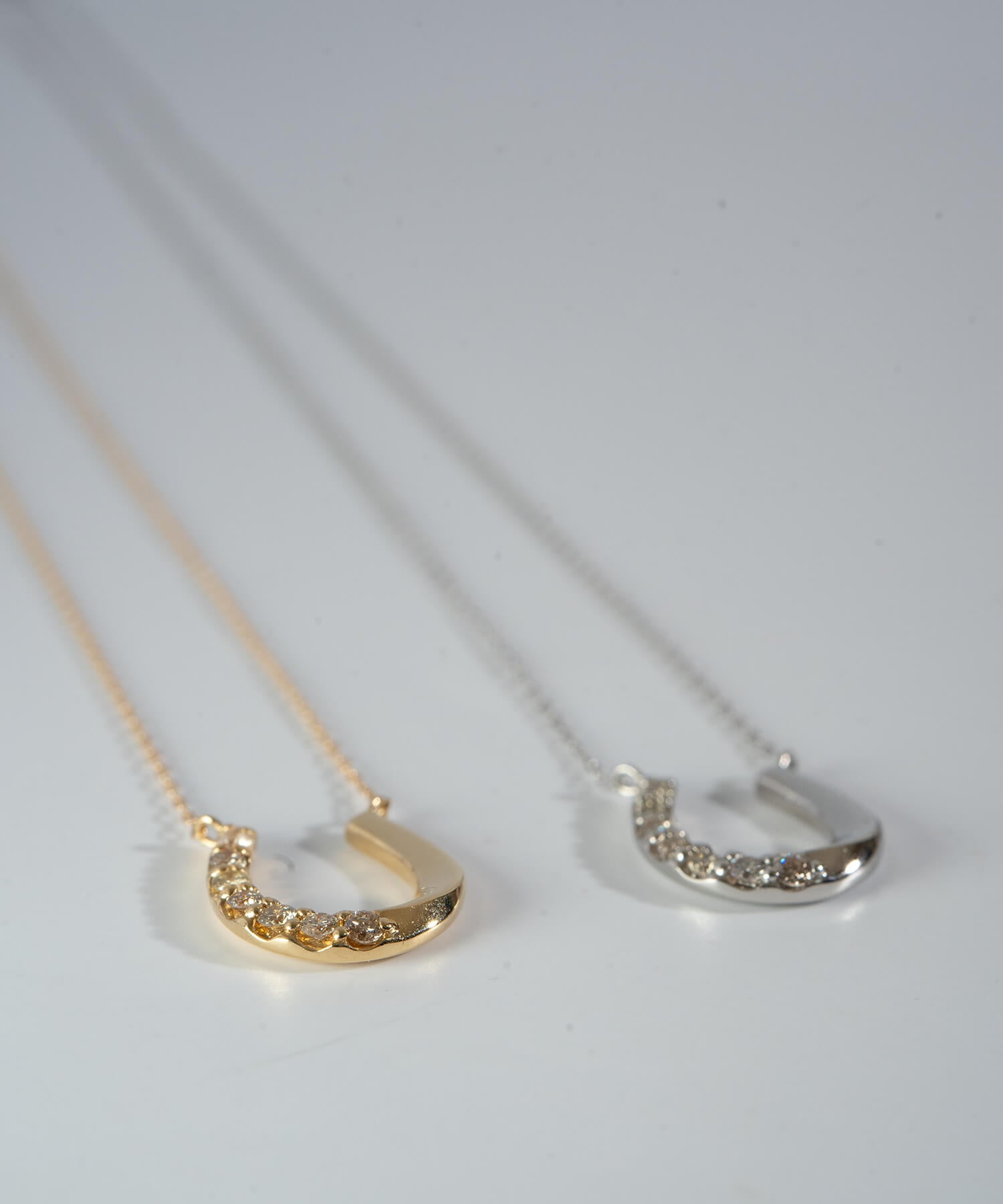 18K Gold & Platinum Diamond Horseshoe Necklace | COUPELLE