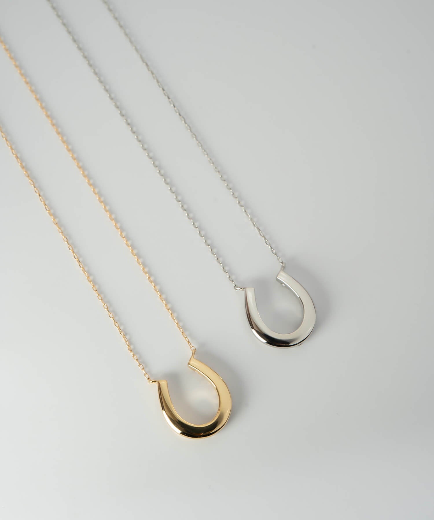 18K Gold & Platinum Diamond Horseshoe Necklace | COUPELLE