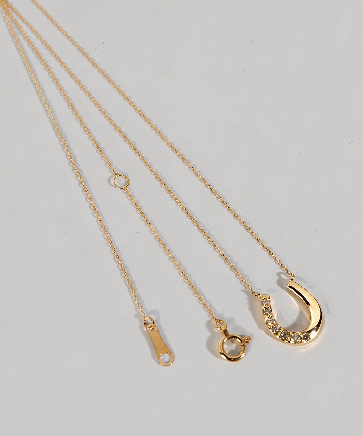 18K Gold & Platinum Diamond Horseshoe Necklace | COUPELLE