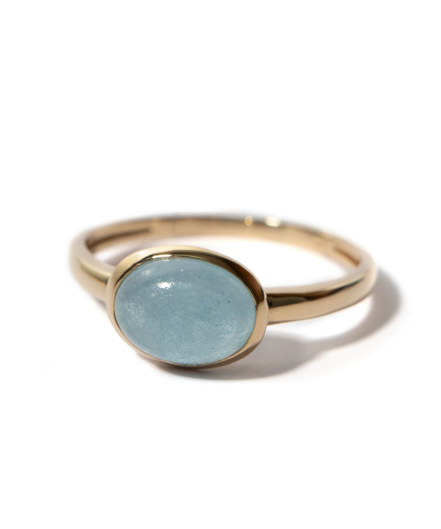 ELIA-TRE 10K gold oval aquamarine ring on a white background