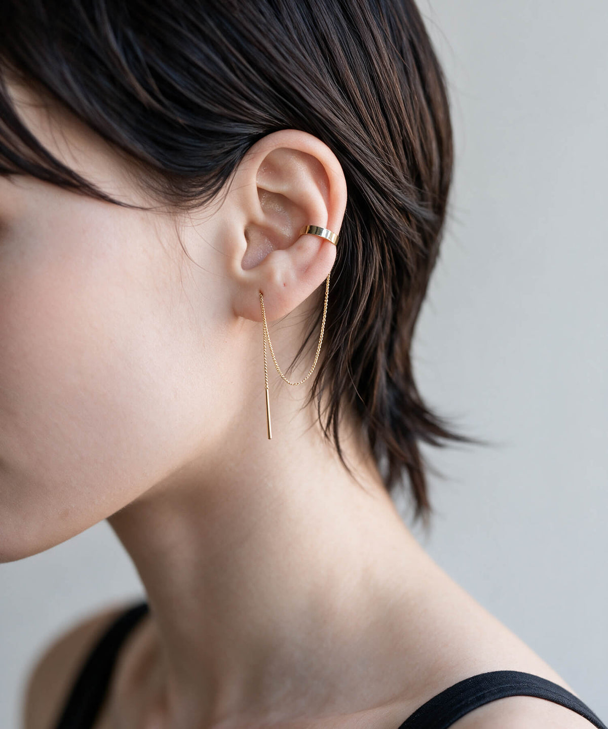 10K gold chain ear cuff worn on the ear rim with the chain threaded through the lobe