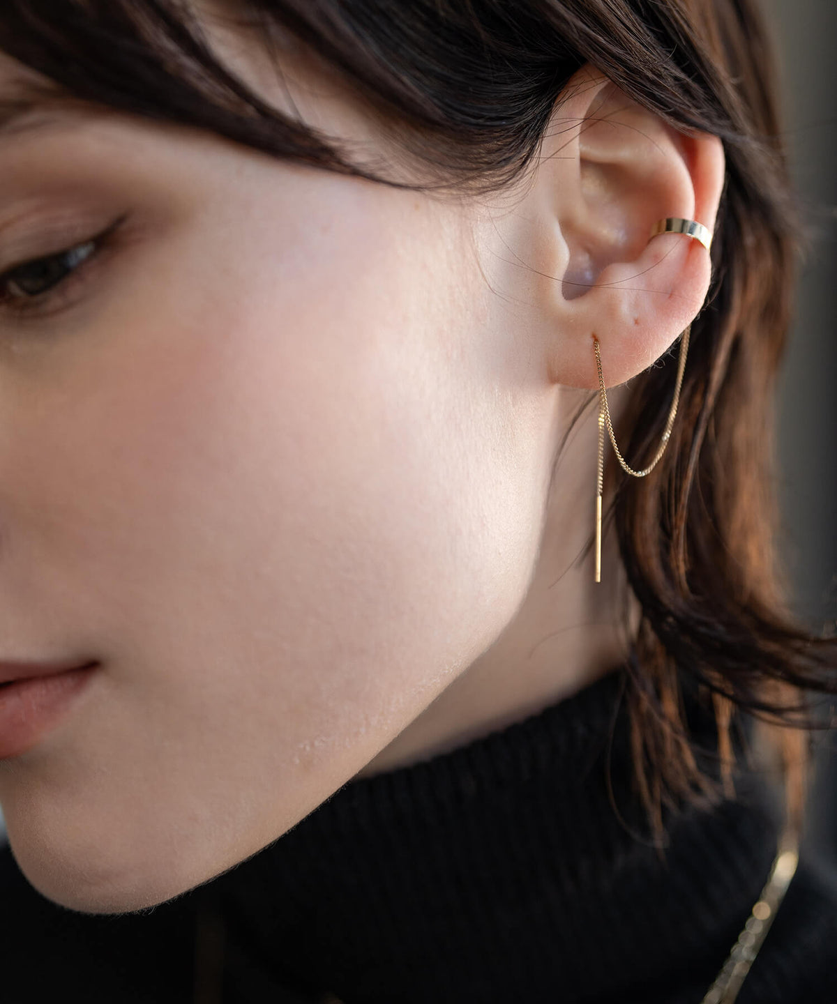 10K gold chain ear cuff worn with hair tucked behind the ear
