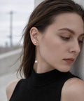 18K pink gold long pearl swing earrings ILMARI worn on ear