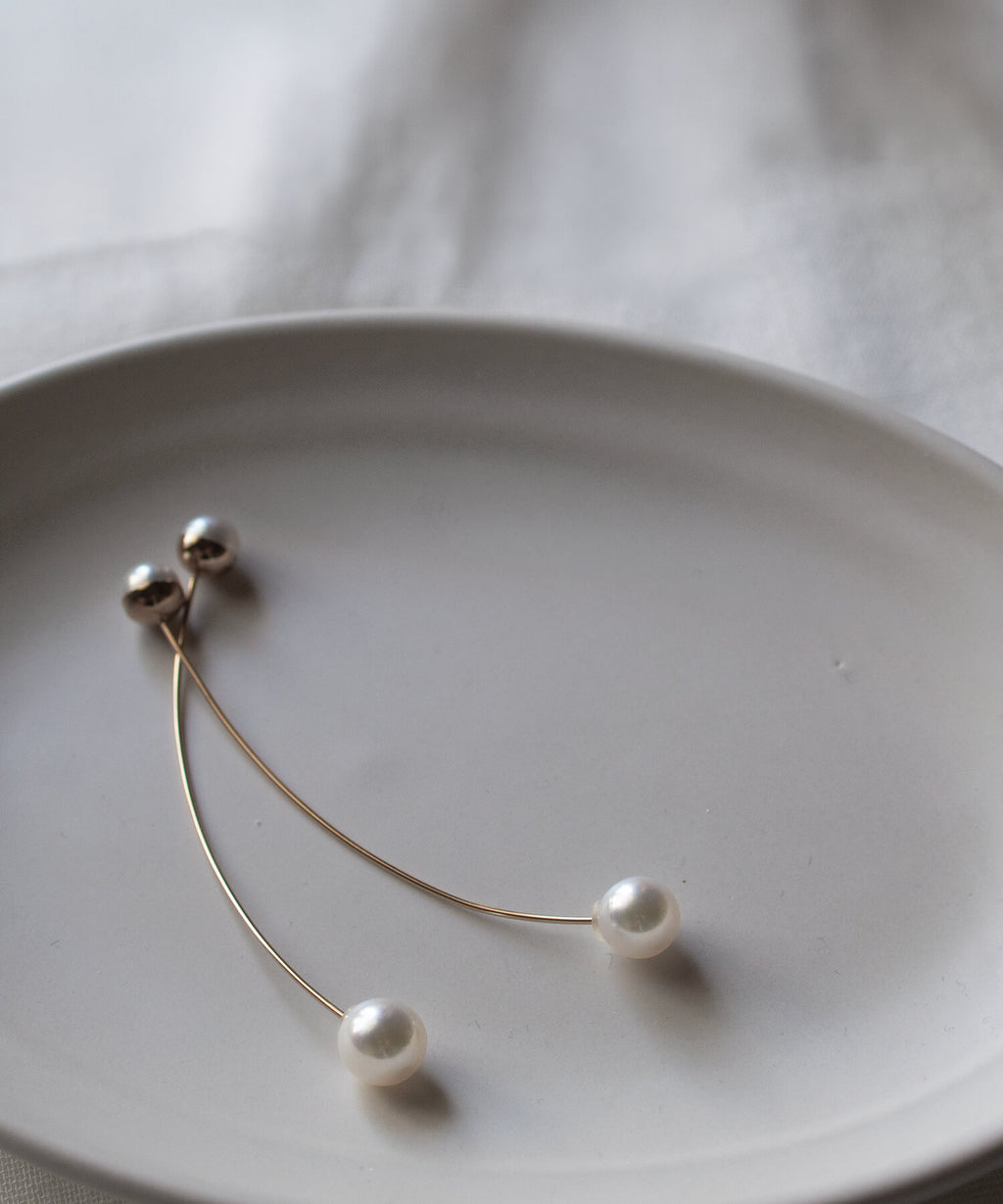 ILMARI 18K pink gold akoya pearl earrings on plate