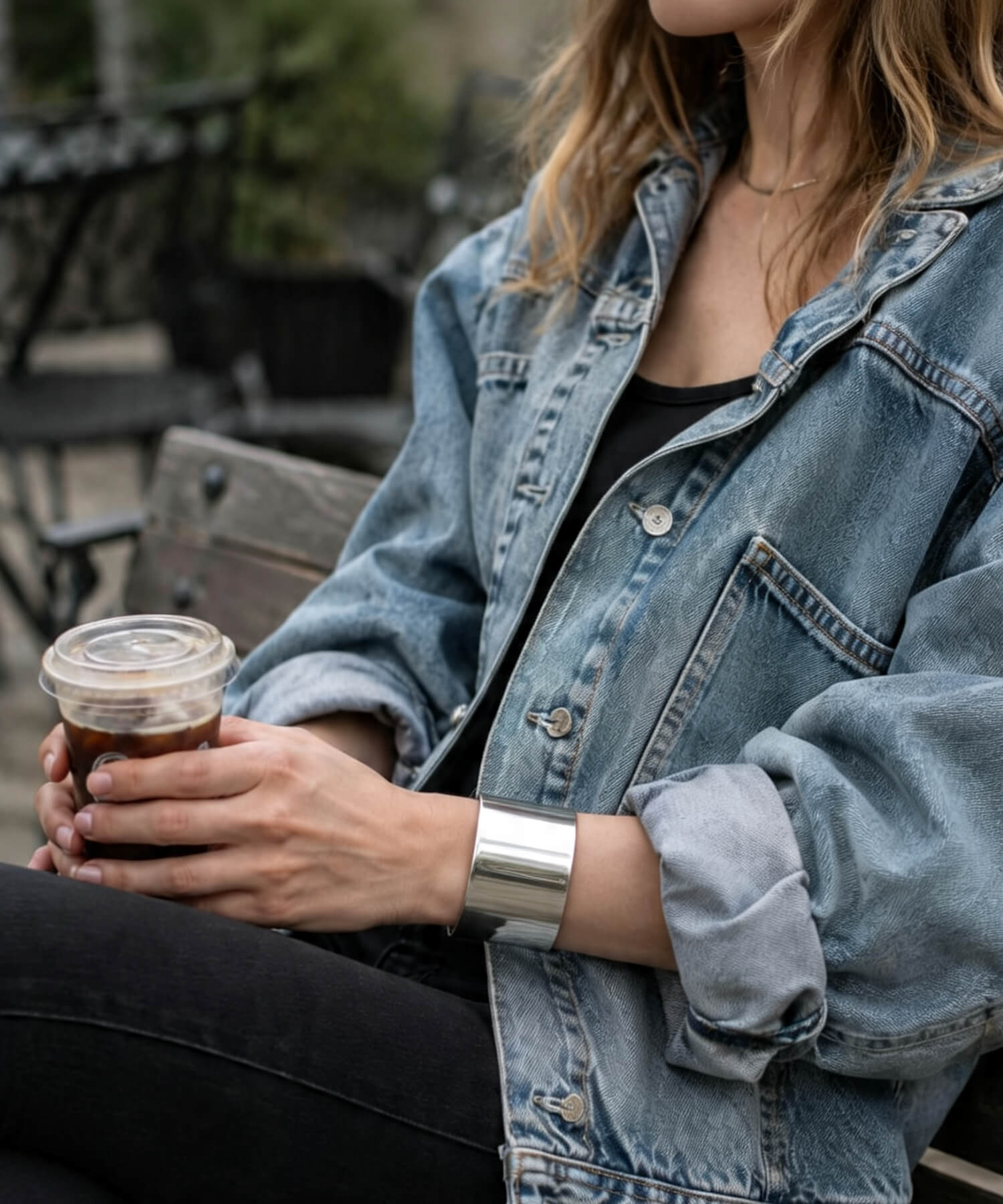 Sterling silver wide cuff bangle worn with a white shirt