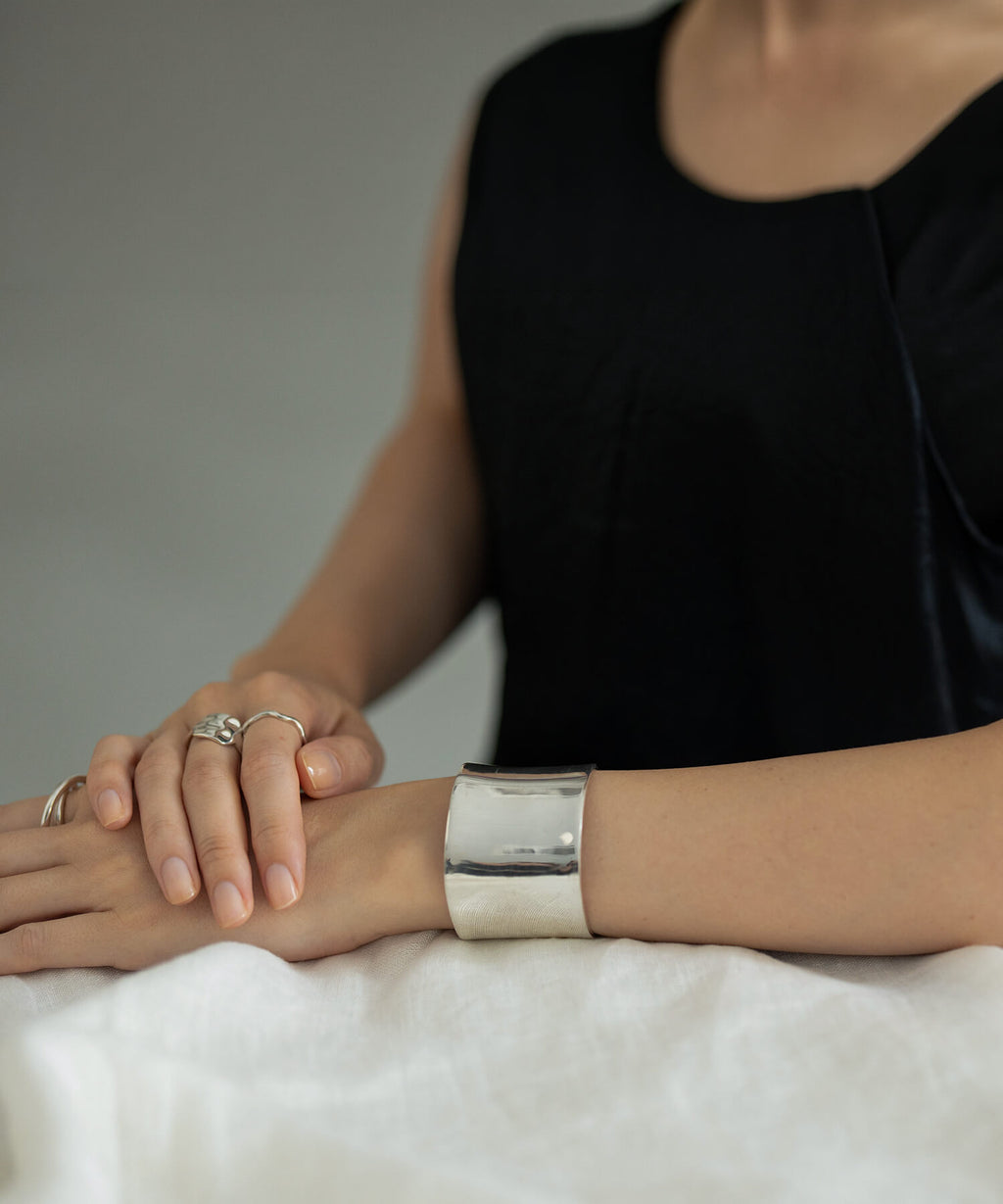 Straight wide cuff bangle styled with denim