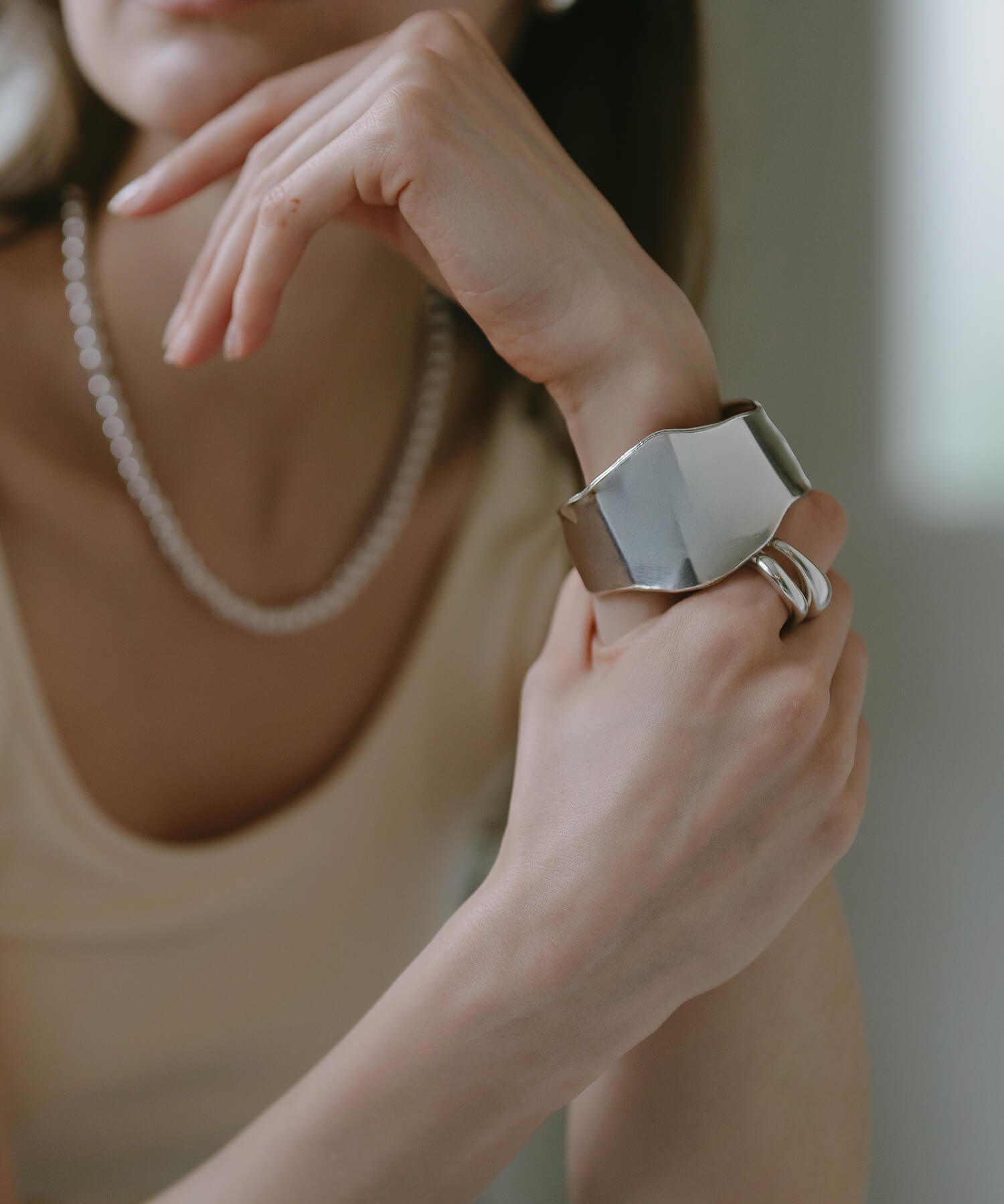 Wave type wide cuff bangle detail on the wrist