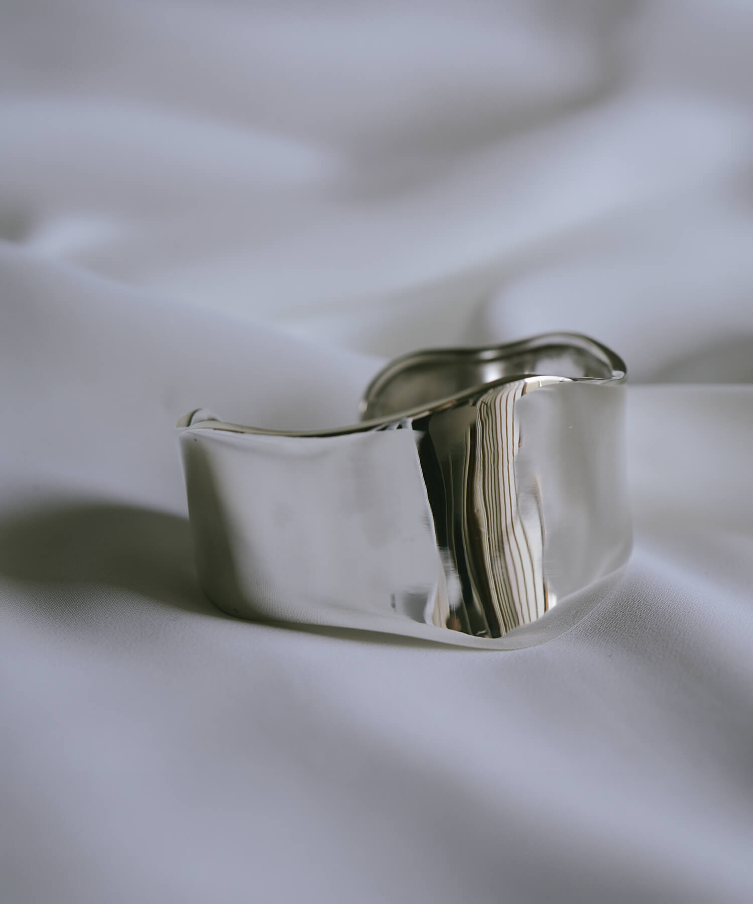 Wave type sterling silver wide cuff bangle, flat lay