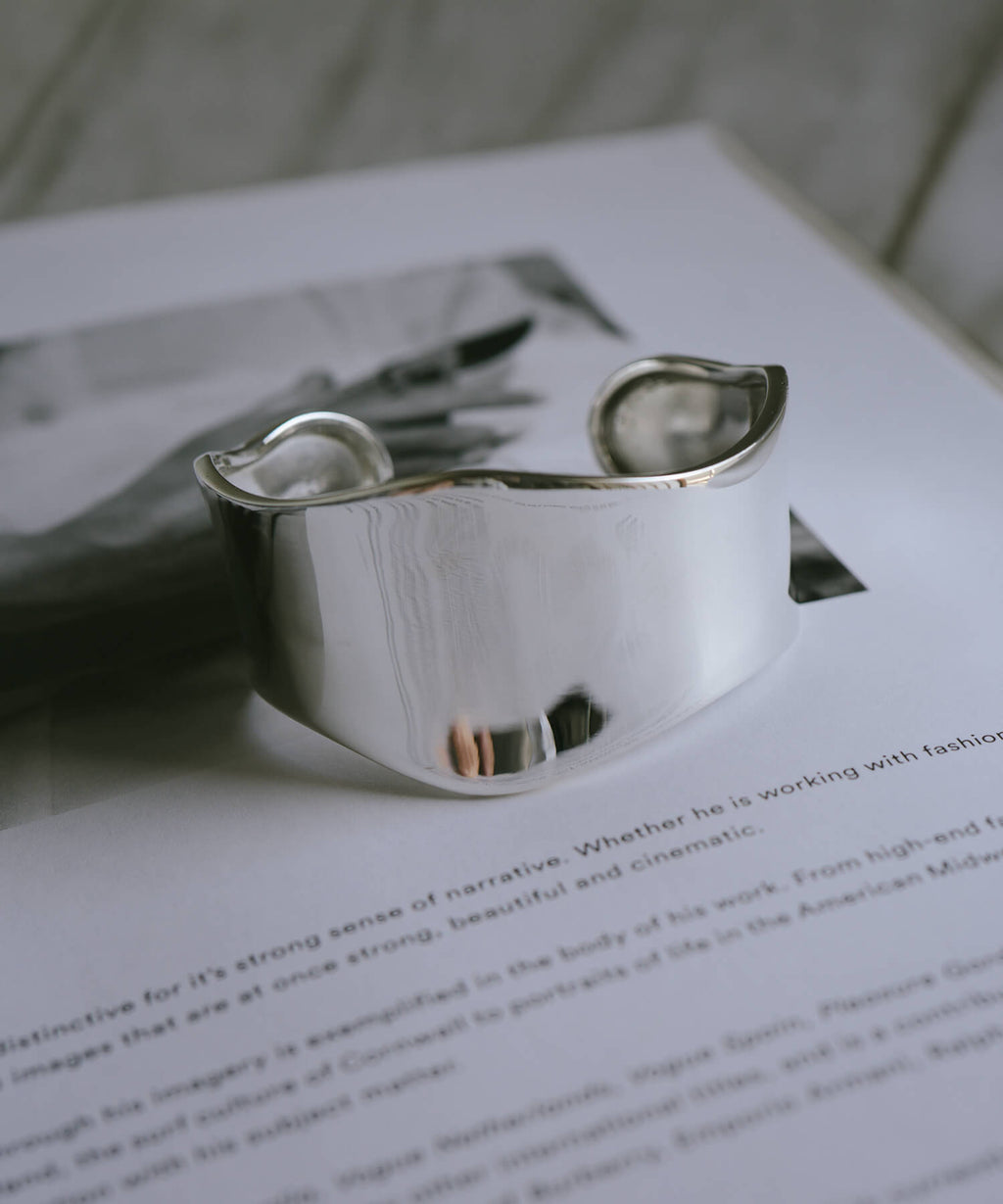Wave type sterling silver wide cuff bangle, angled view