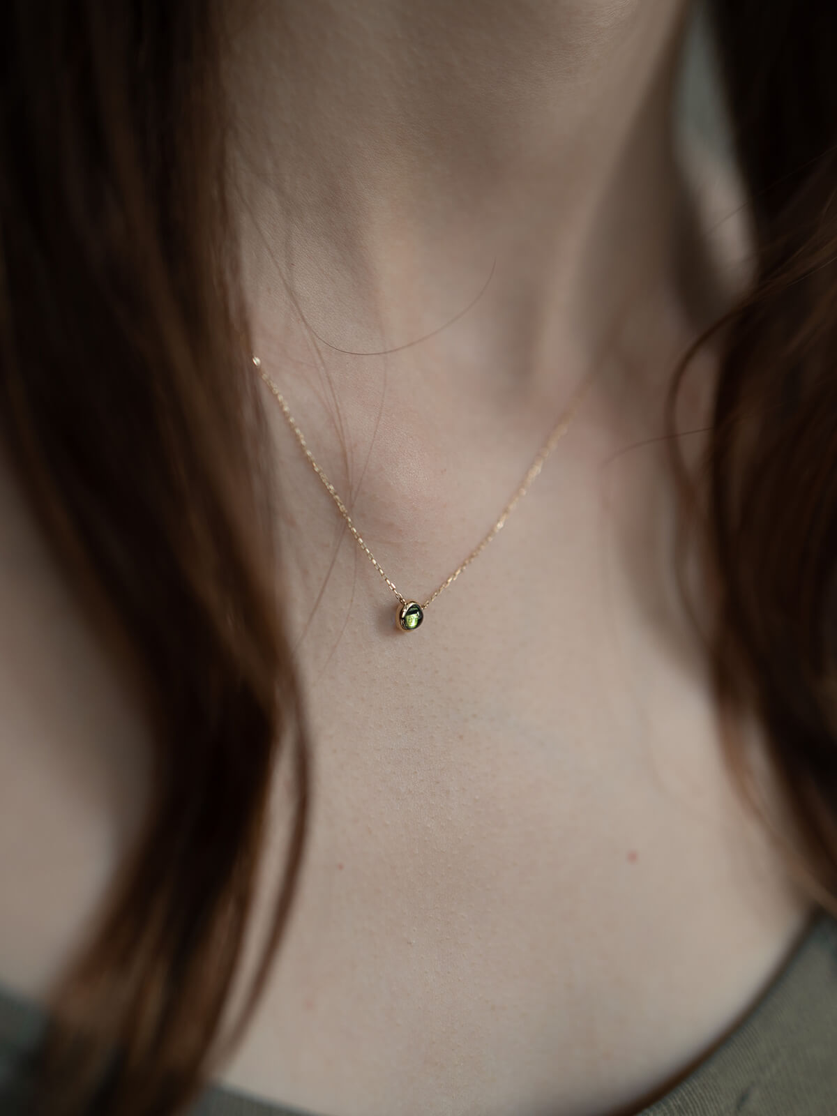 Peridot necklace on model
