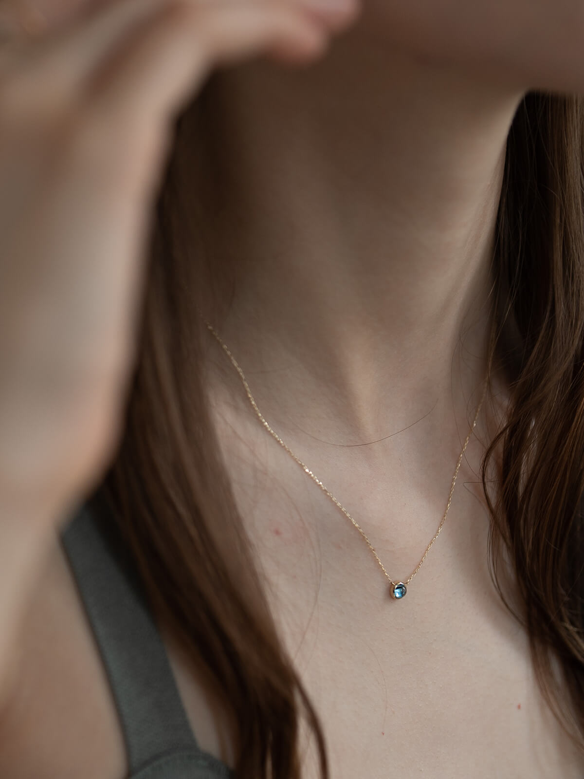 Swiss blue topaz necklace on model
