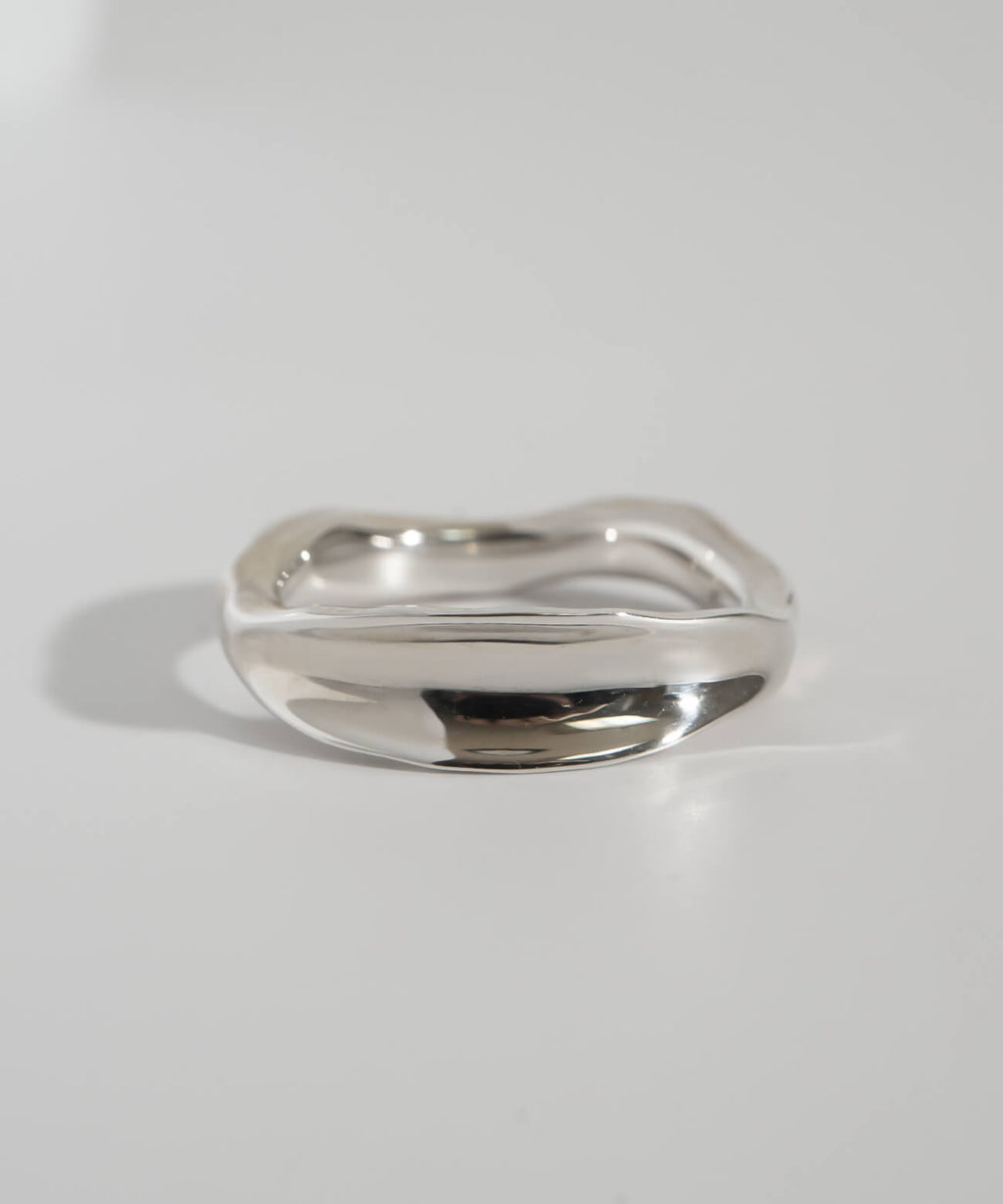 Close-up of the ripple wave ring showing its uneven polished edge