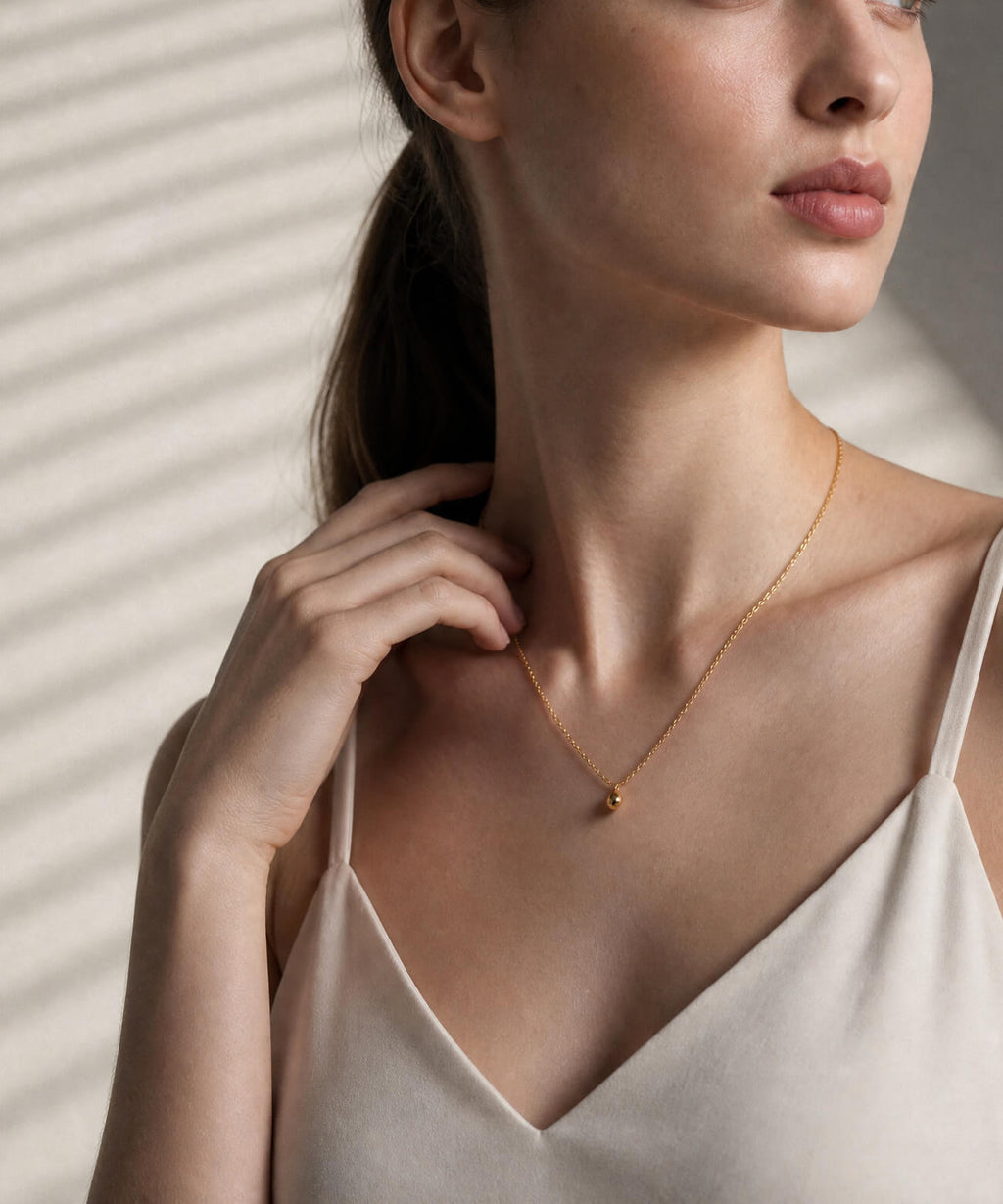 18K gold egg pendant necklace side view