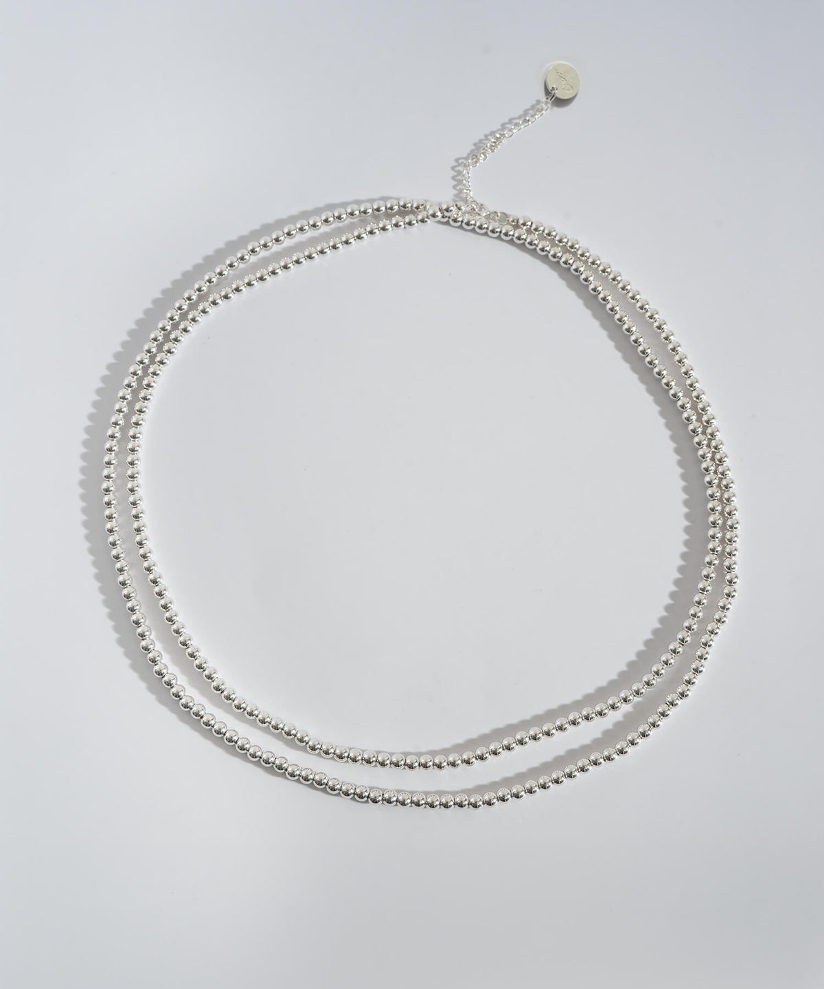 Silver ball chain necklace doubled into two loops