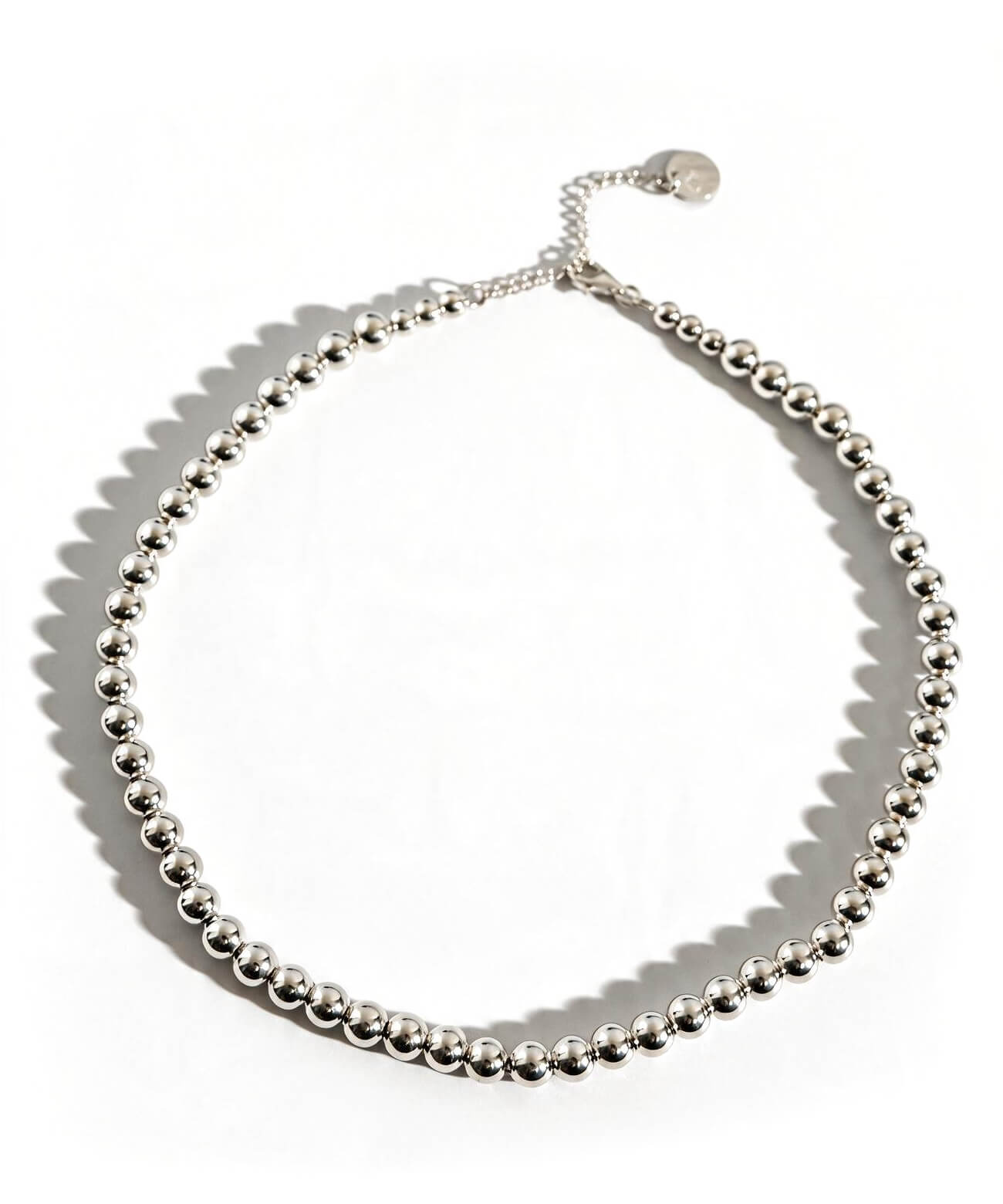 Sterling silver 7mm ball chain necklace on a white background