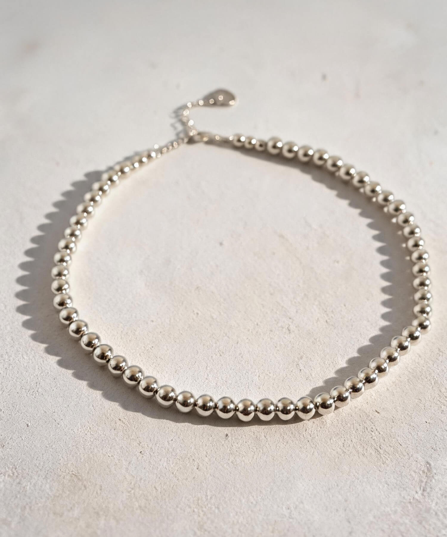 Sterling silver 7mm ball chain necklace laid flat