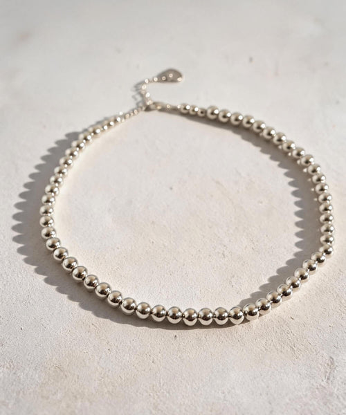 Sterling silver 7mm ball chain necklace laid flat