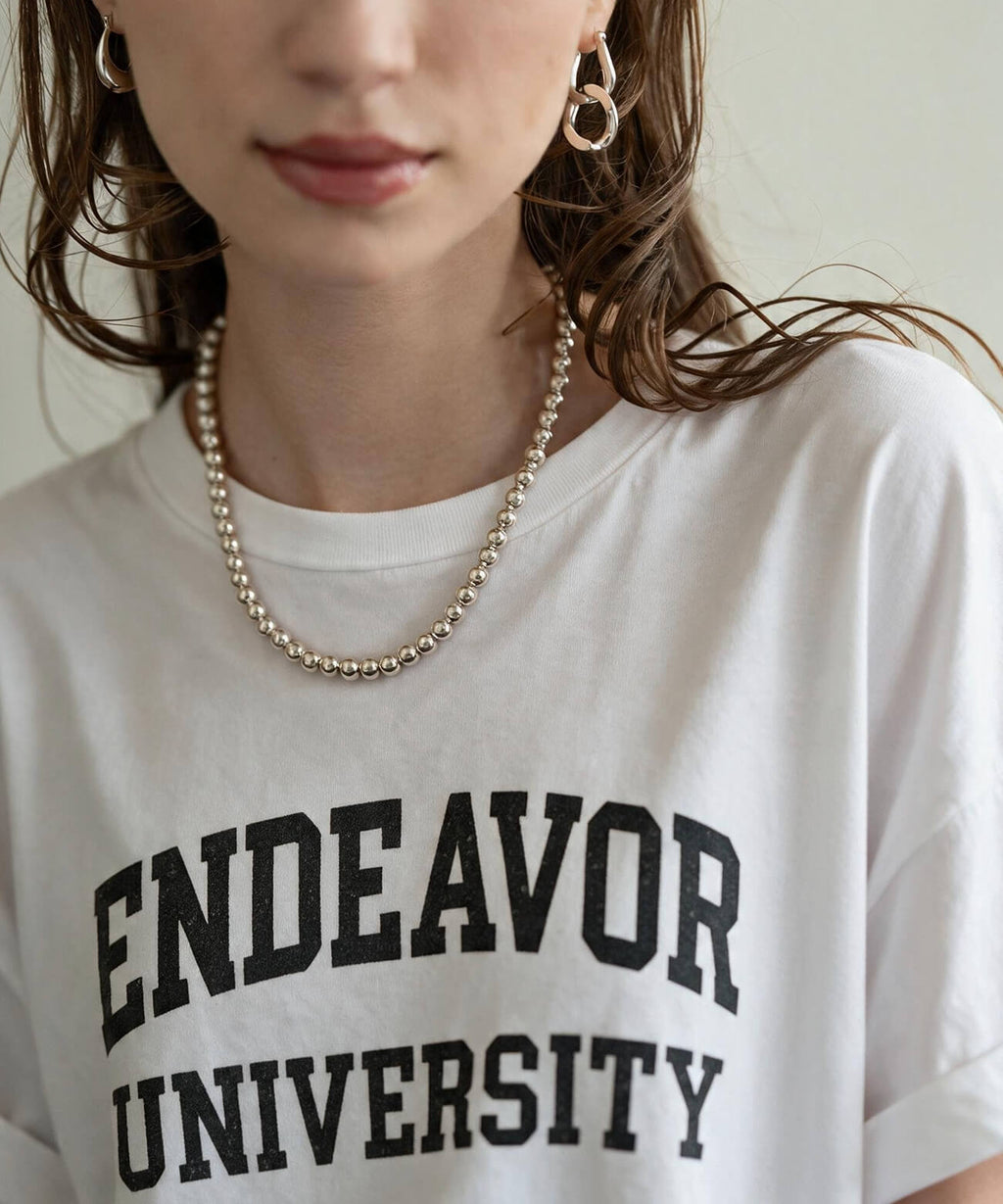 Sterling silver ball chain necklace with a white printed T-shirt