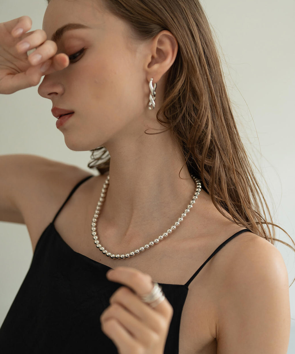 Sterling silver ball chain necklace worn with a black camisole