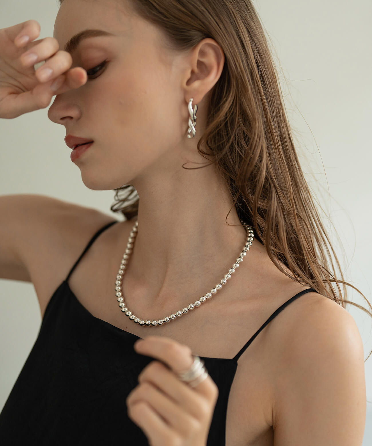Sterling silver ball chain necklace worn with a black camisole