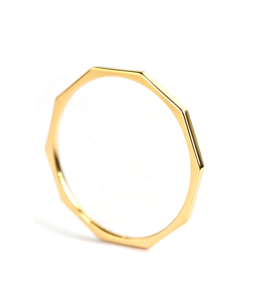 18K gold decagon skinny ring on a white background