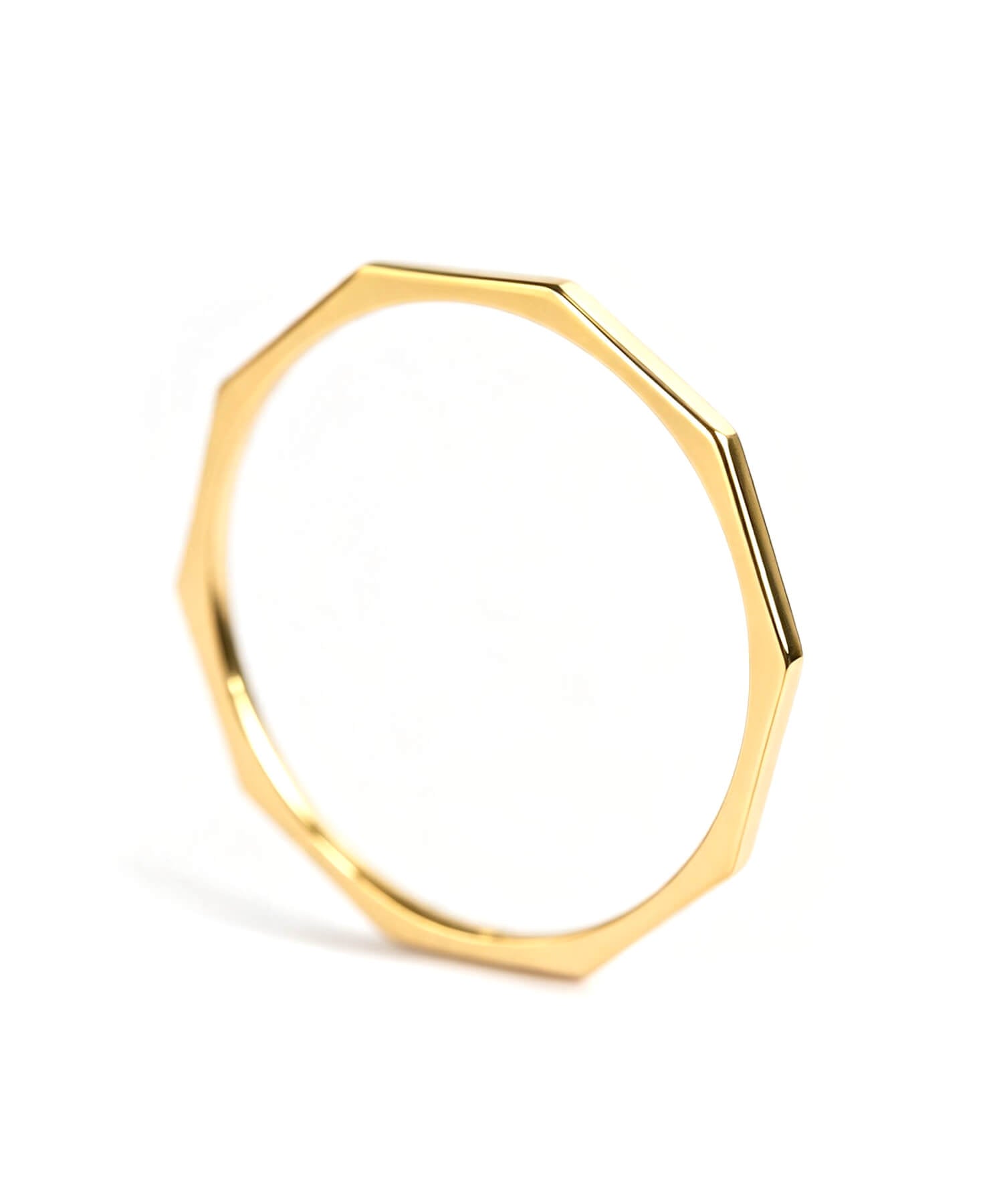 18K gold decagon skinny ring on a white background