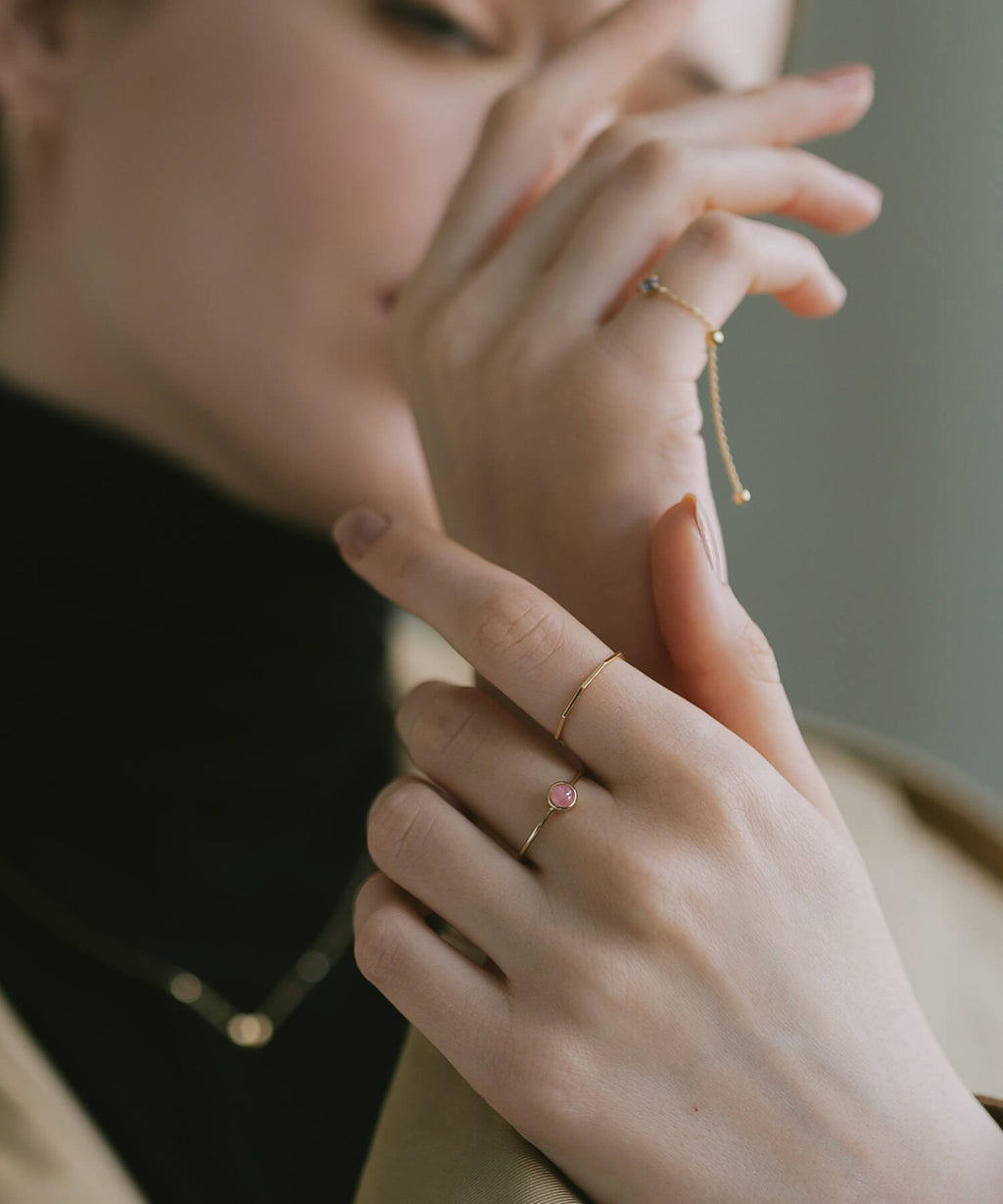 18K gold decagon skinny rings worn on two fingers