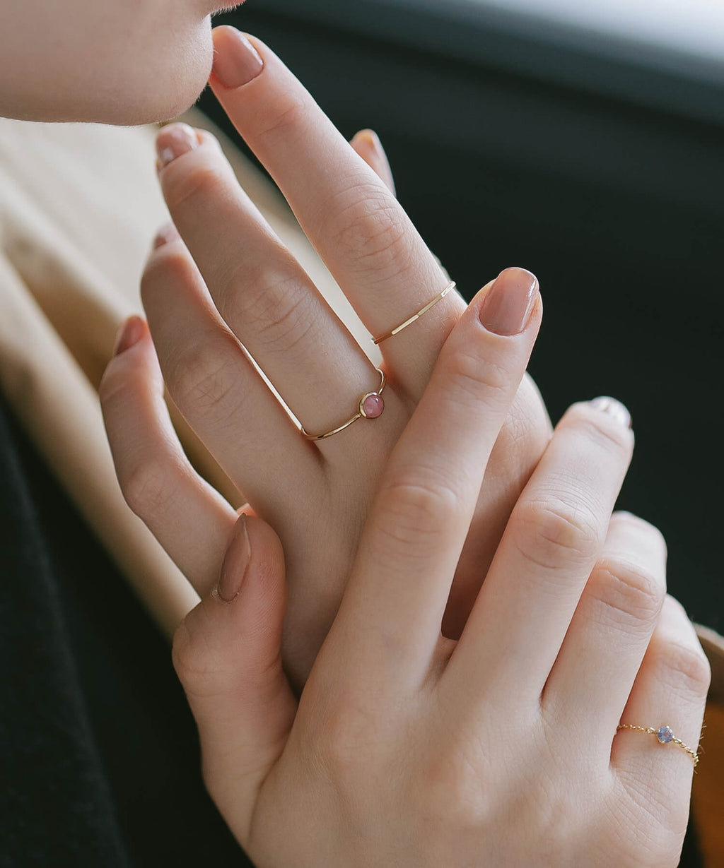 18K gold decagon skinny rings worn on both hands