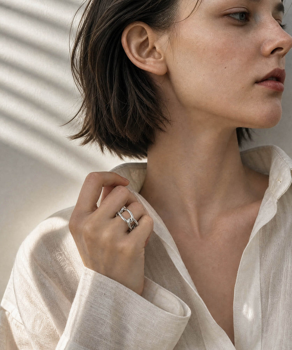 Model with short hair wearing the sterling silver chunky chain ring