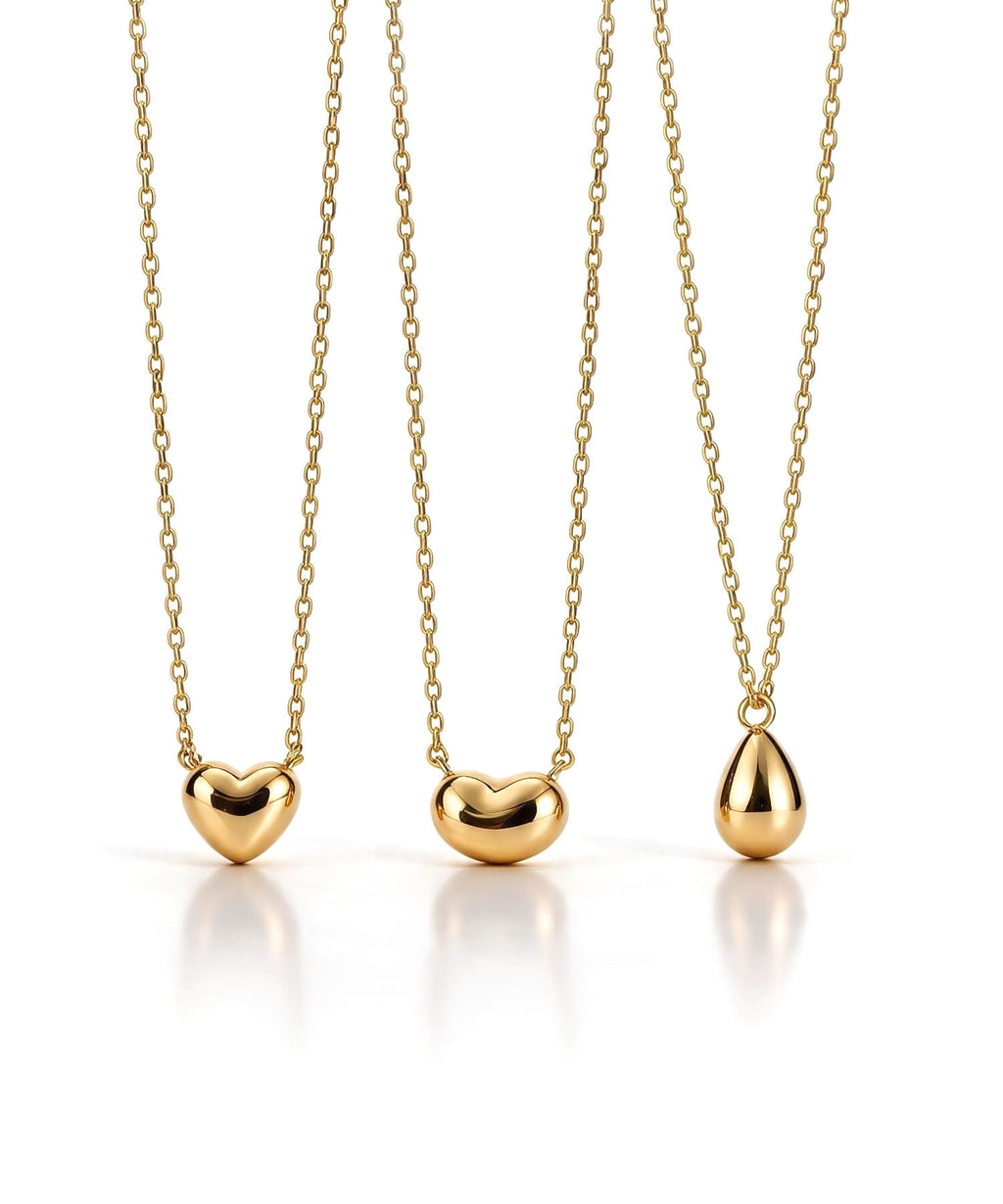 18K gold petit grain necklace on a white background