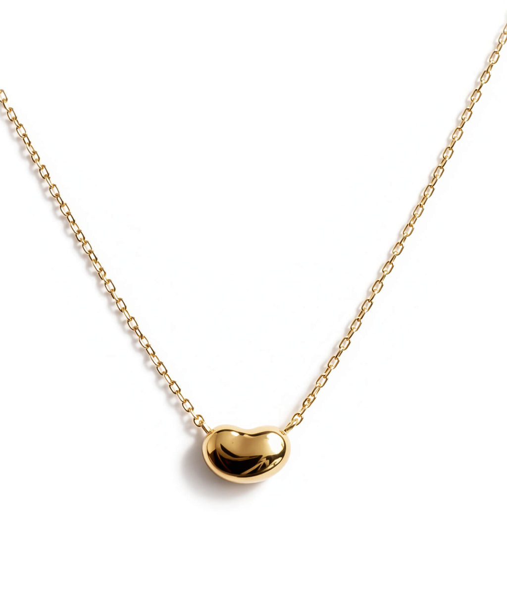 18K gold fave bean pendant necklace on a white background