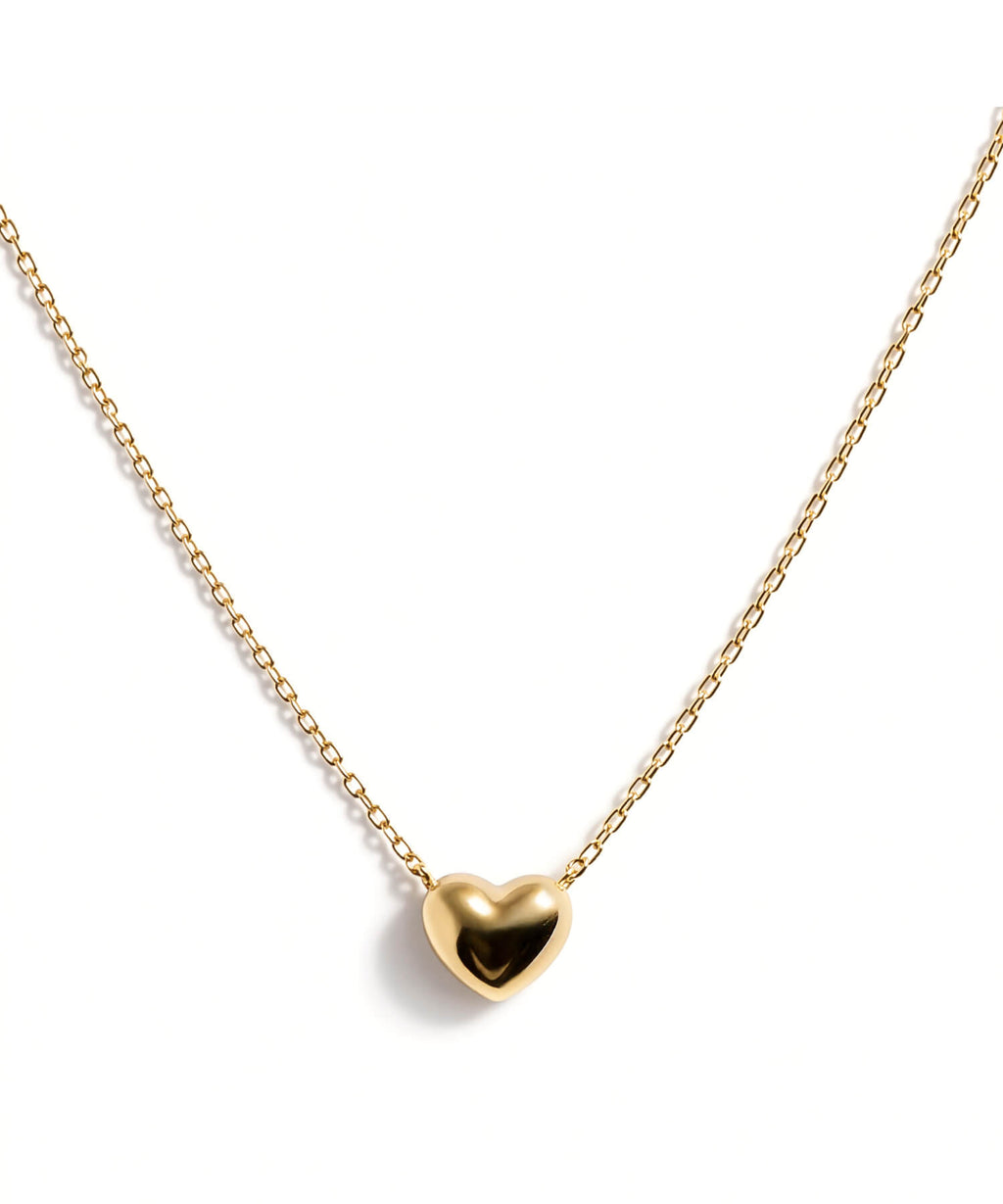 18K gold heart pendant necklace on a white background